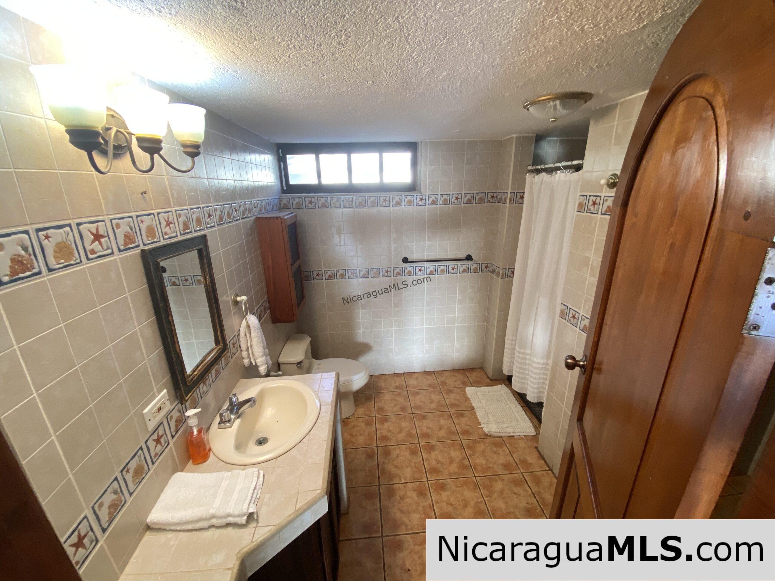 Landmark entertainer home in a quiet, gated development mere minutes from town