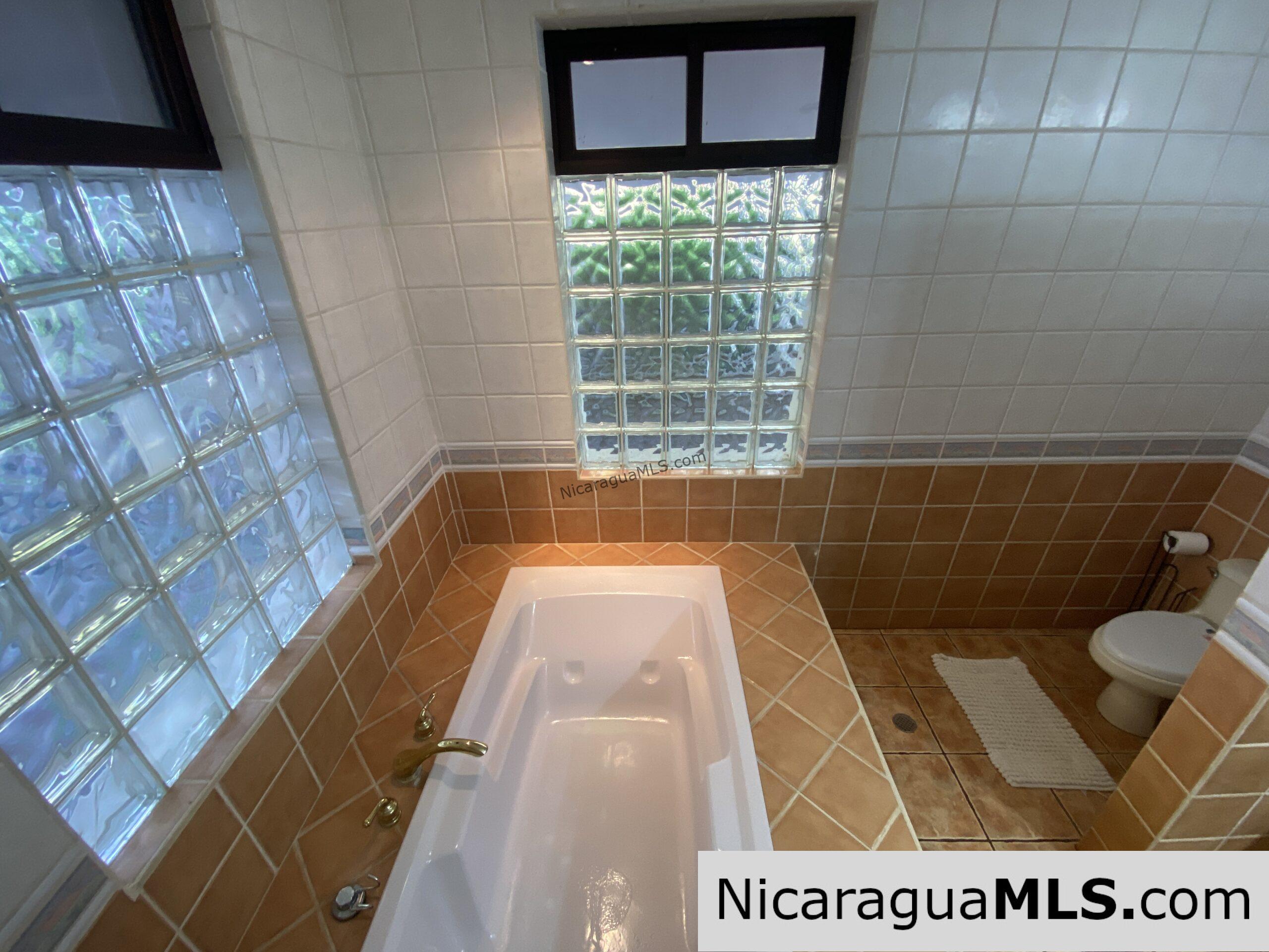 Landmark entertainer home in a quiet, gated development mere minutes from town