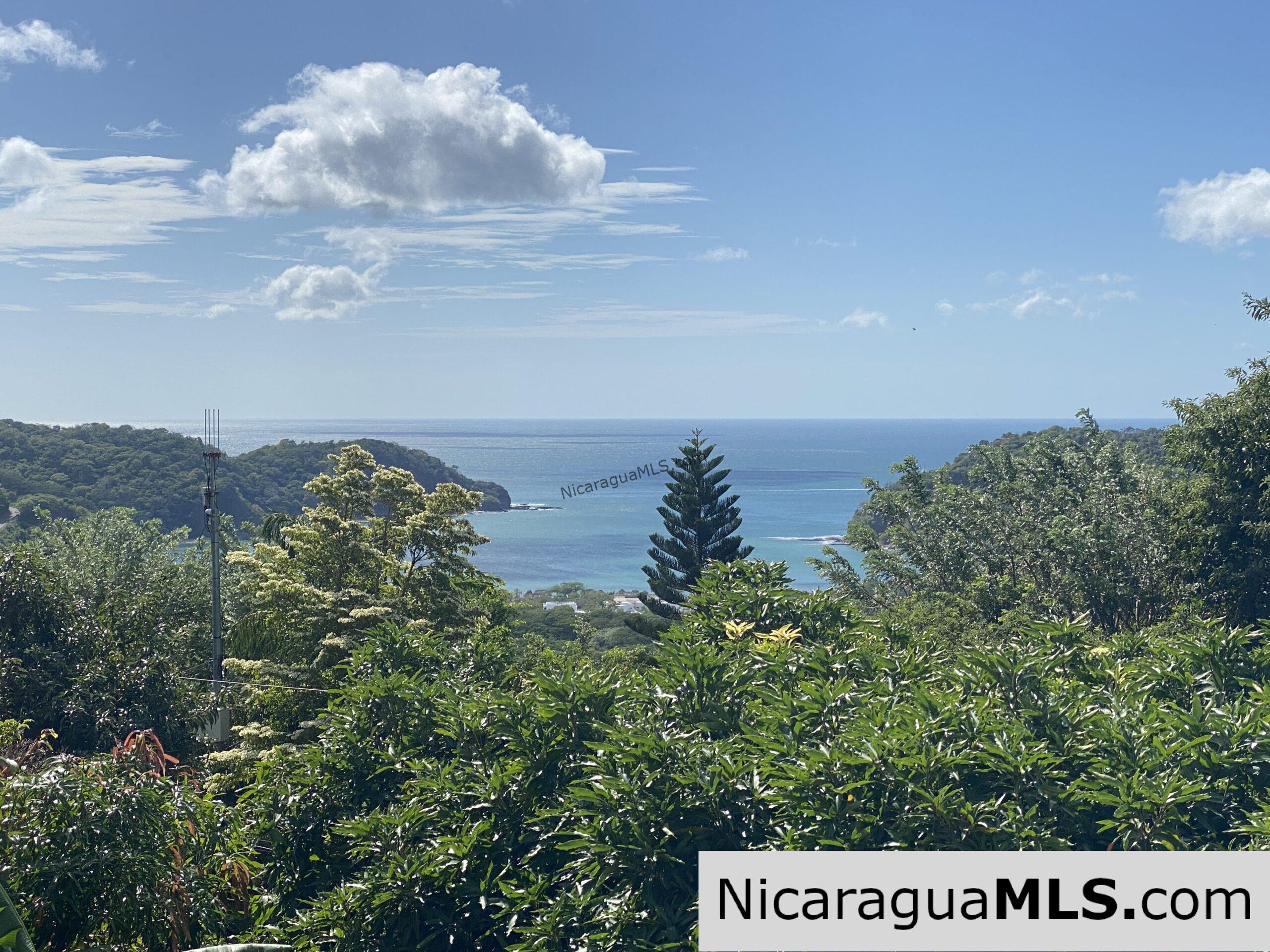 Landmark entertainer home in a quiet, gated development mere minutes from town