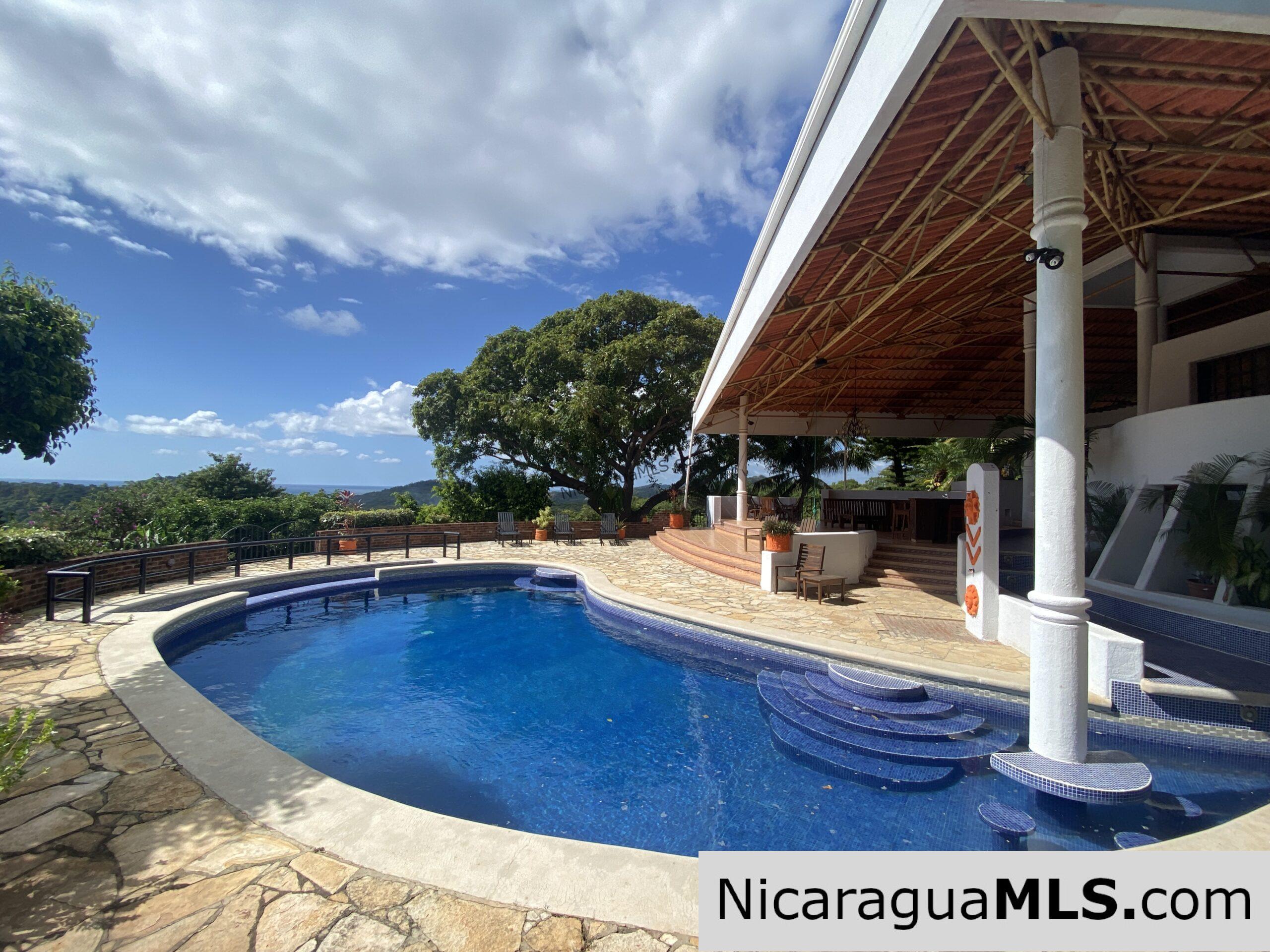 Landmark entertainer home in a quiet, gated development mere minutes from town